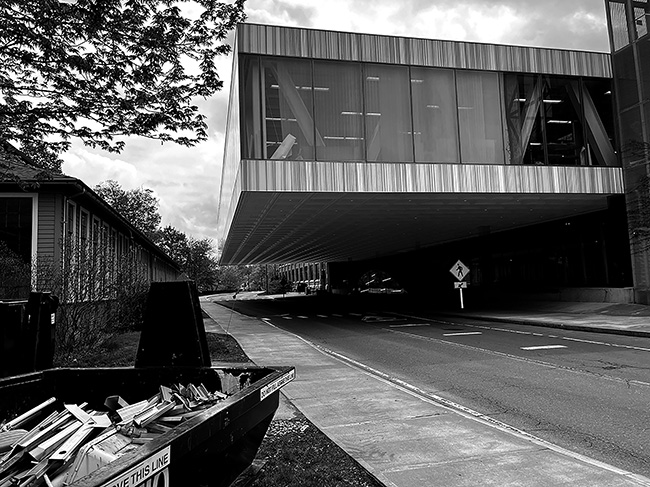 View looking east on University Avenue with Milstein Hall's cantilever over the street visible.