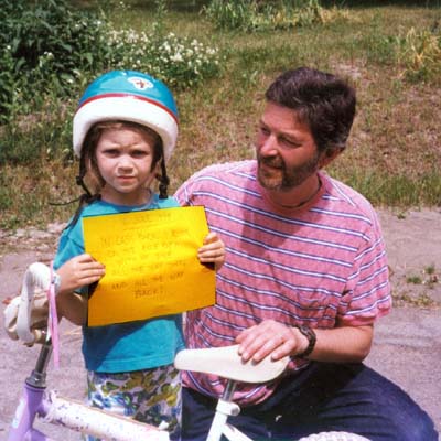 J. Ochshorn and Jennie ride bikes, 1999