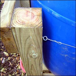 barrel tied to wood frame