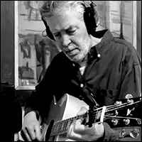 Jonathan Ochshorn playing guitar