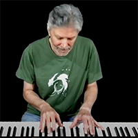 Jonathan Ochshorn at piano playing Ballad of Building Bad=